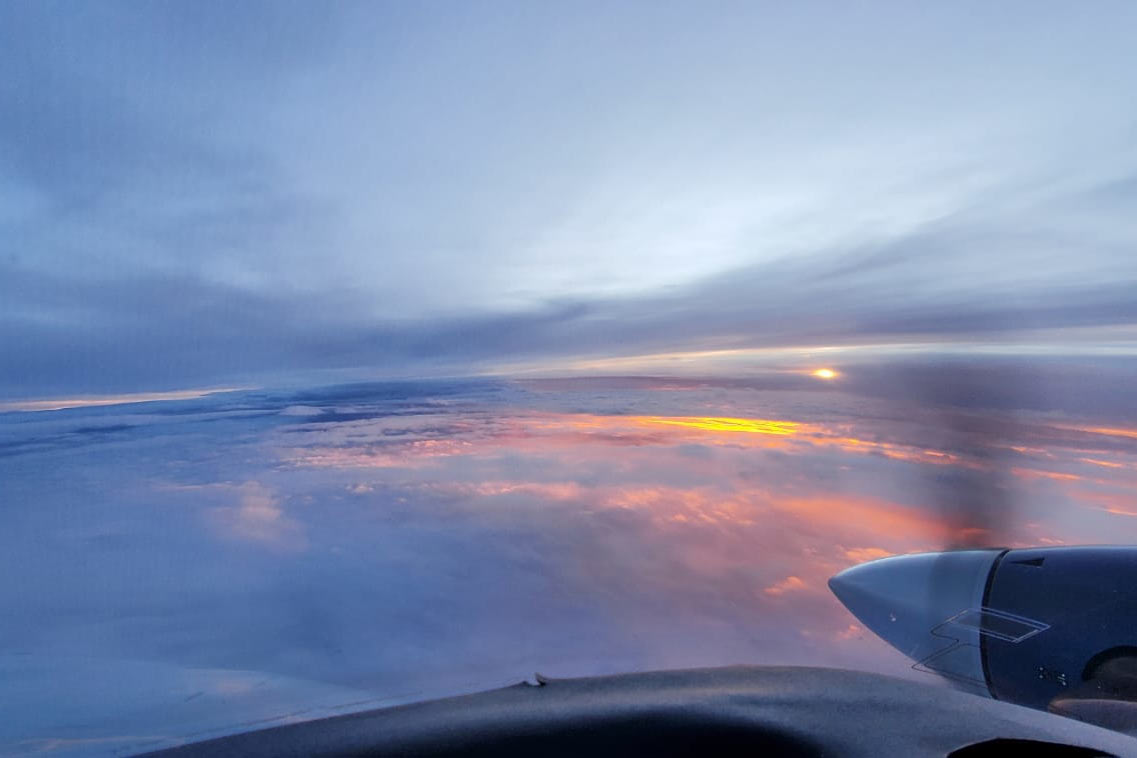 sun on horizon while flying